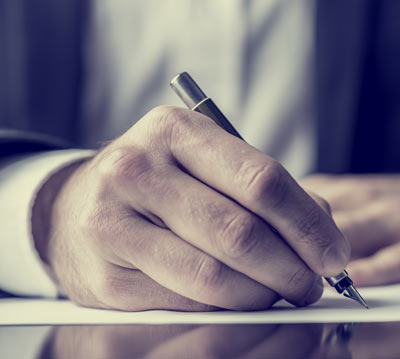man writing essay
